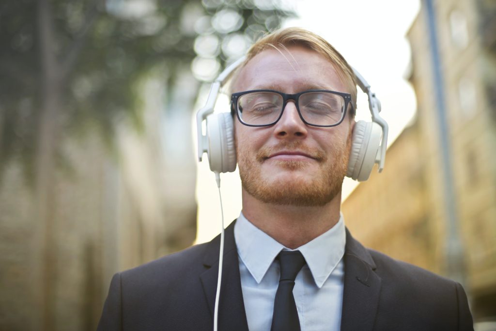 Cheerful man wearing earphones