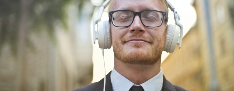 Cheerful man wearing earphones