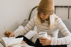 Young Woman Studying English Phrases